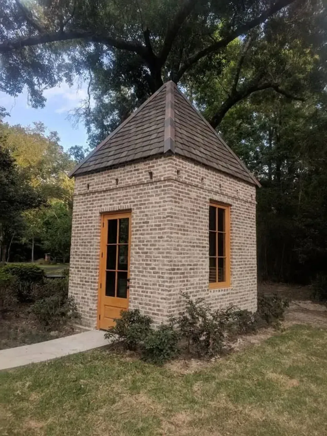 Brick garden house with custom roof built by W2 Commercial Construction