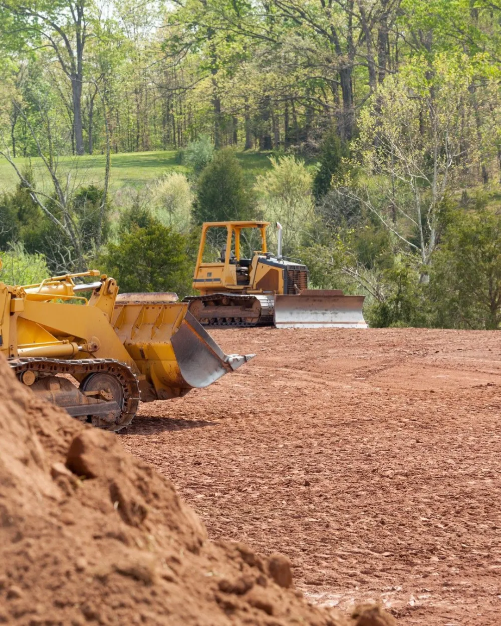Wheel loader grading and leveling a construction site for a new pad on the Northshore